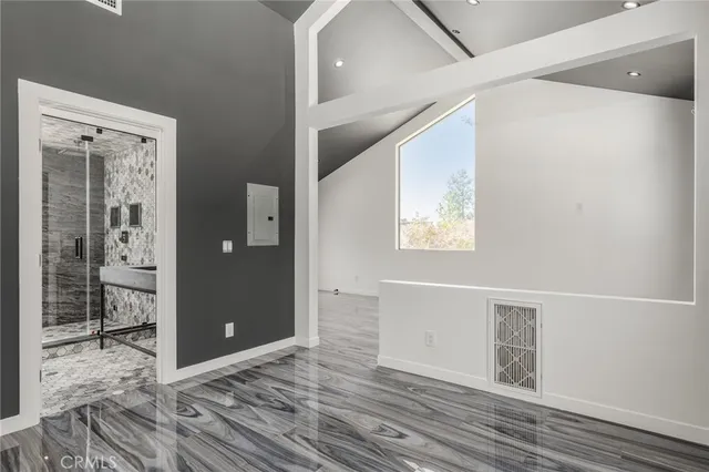 a bathroom with a shower and a sink