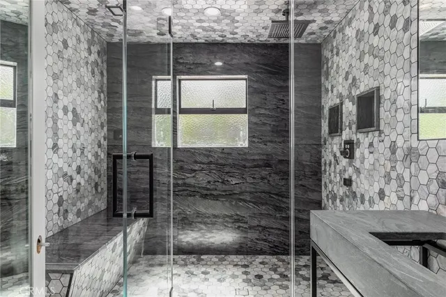 a view of a patio with table and chairs a barbeque with wooden floor and roof