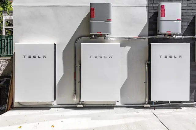 a utility room with multiple dryer and washer