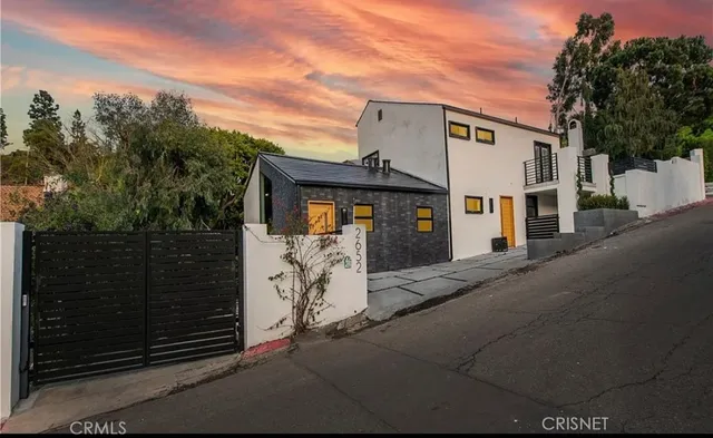 an aerial view of a house with a garden