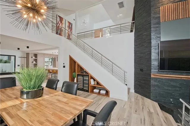a dining room with furniture and wooden floor