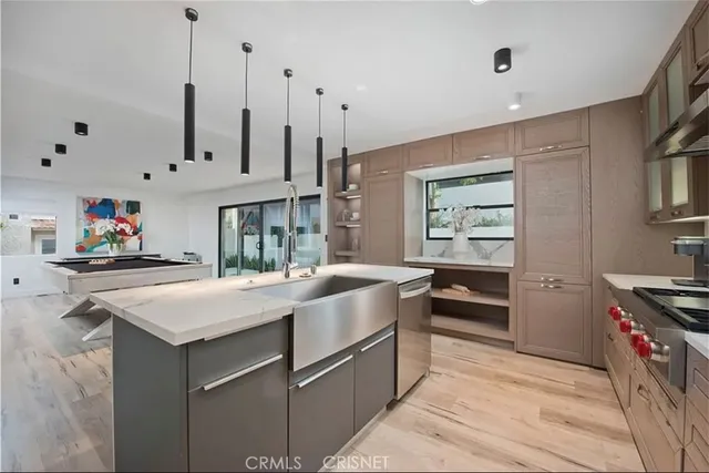 a kitchen that has a lot of cabinets in it