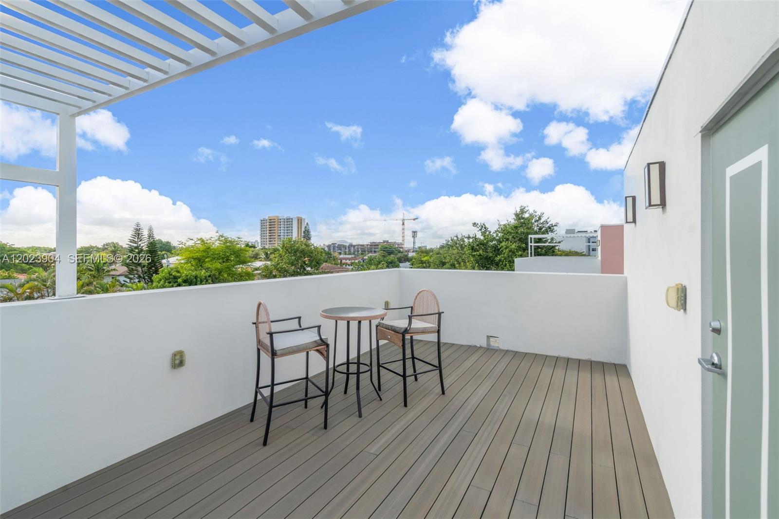 721 Southwest 11th Street, Unit G Miami, FL 33129 - Photo 30 of 40 a view of a terrace with seating space
