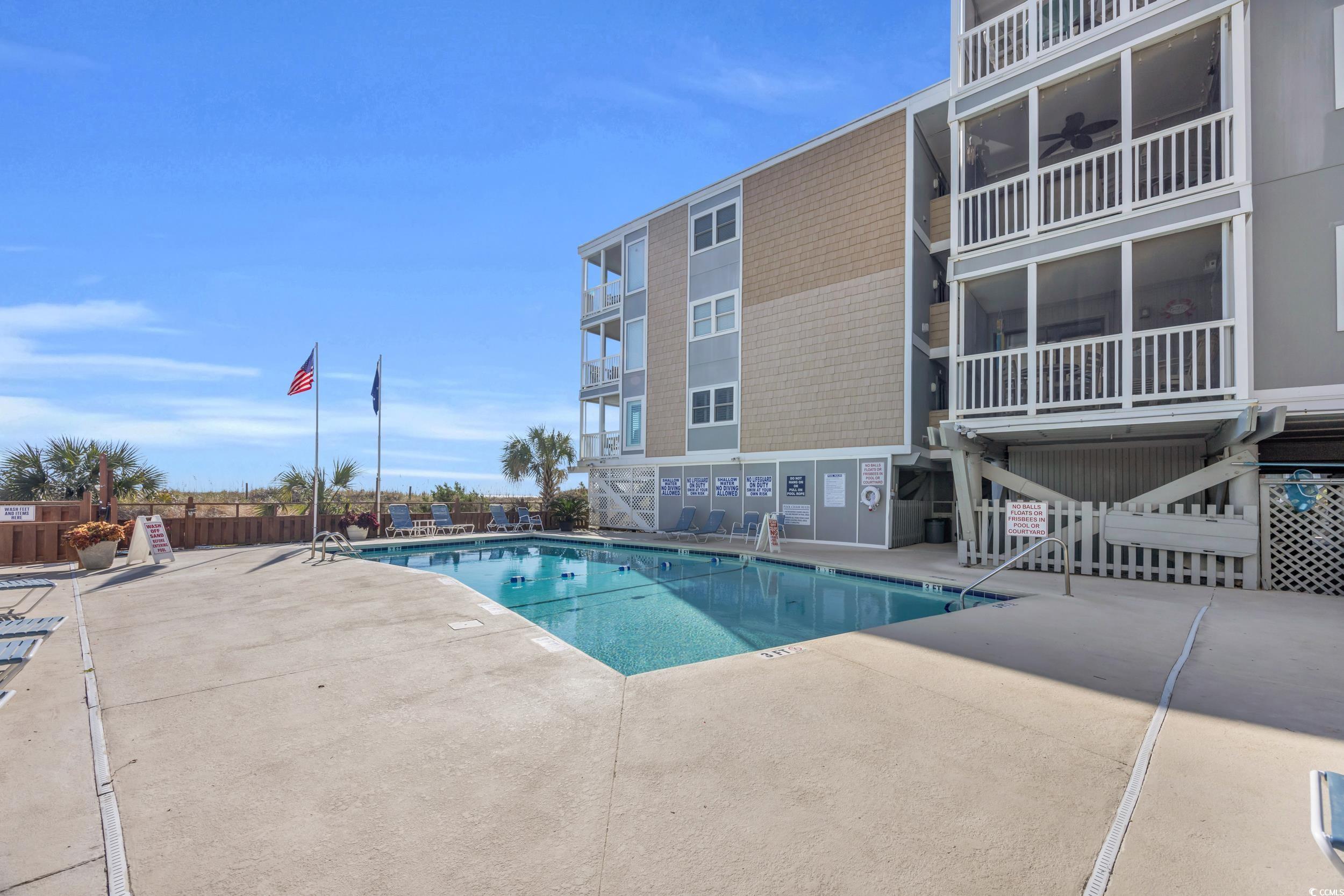 2405 South Ocean Boulevard, Unit 306 North Myrtle Beach, SC 29582 - Photo 22 of 37 View of pool with ceiling fan and a patio