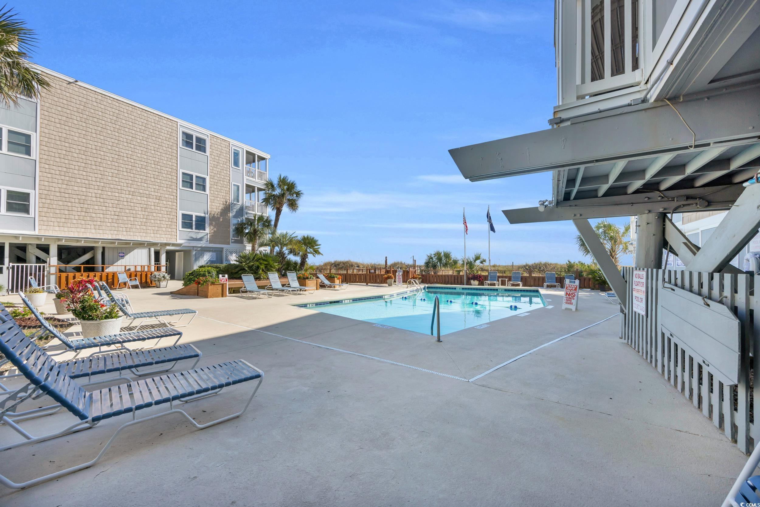 2405 South Ocean Boulevard, Unit 306 North Myrtle Beach, SC 29582 - Photo 23 of 37 View of pool featuring a patio area