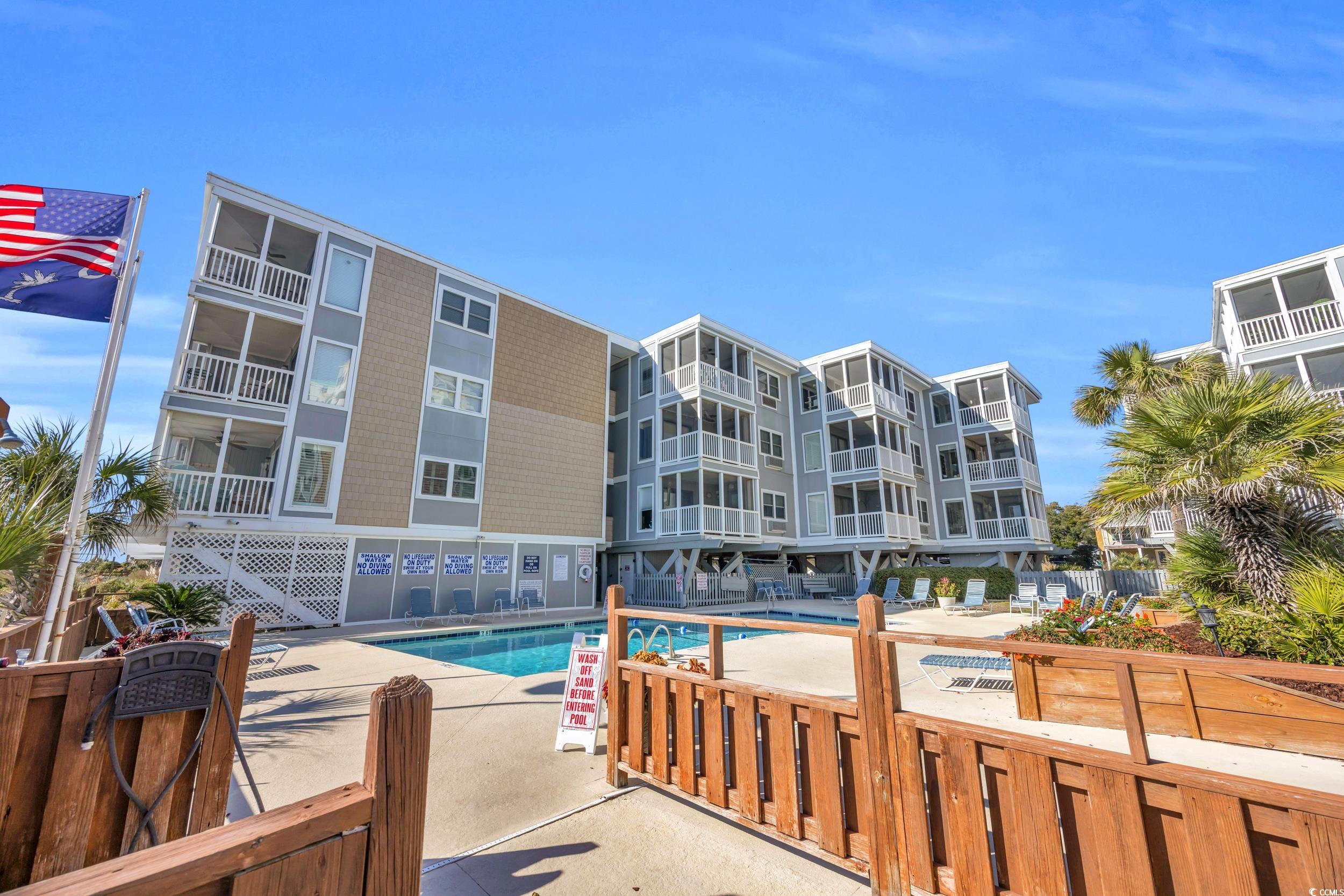 2405 South Ocean Boulevard, Unit 306 North Myrtle Beach, SC 29582 - Photo 24 of 37 View of swimming pool featuring a patio area