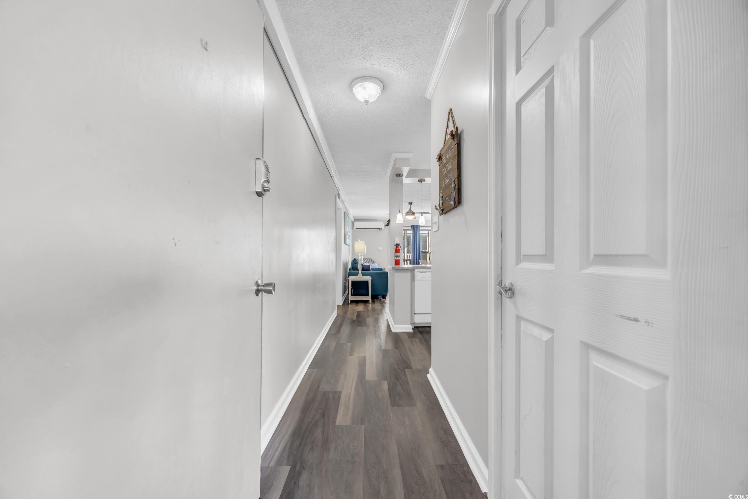 2405 South Ocean Boulevard, Unit 306 North Myrtle Beach, SC 29582 - Photo 5 of 37 Hall featuring crown molding, dark hardwood / wood