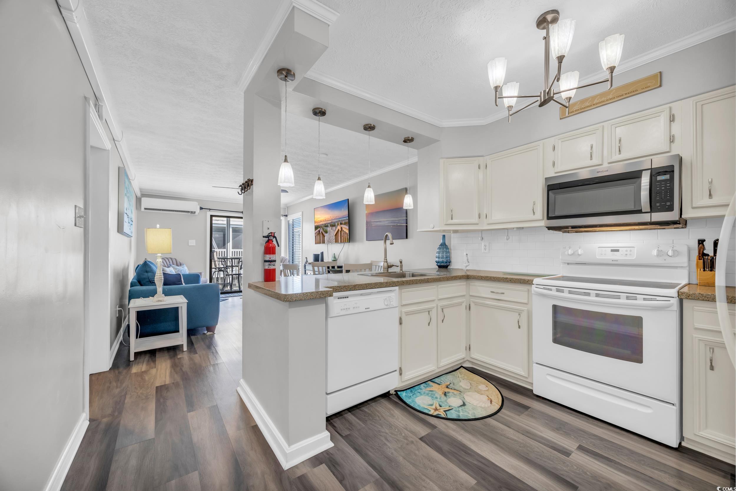 2405 South Ocean Boulevard, Unit 306 North Myrtle Beach, SC 29582 - Photo 7 of 37 Kitchen featuring ornamental molding, white applia