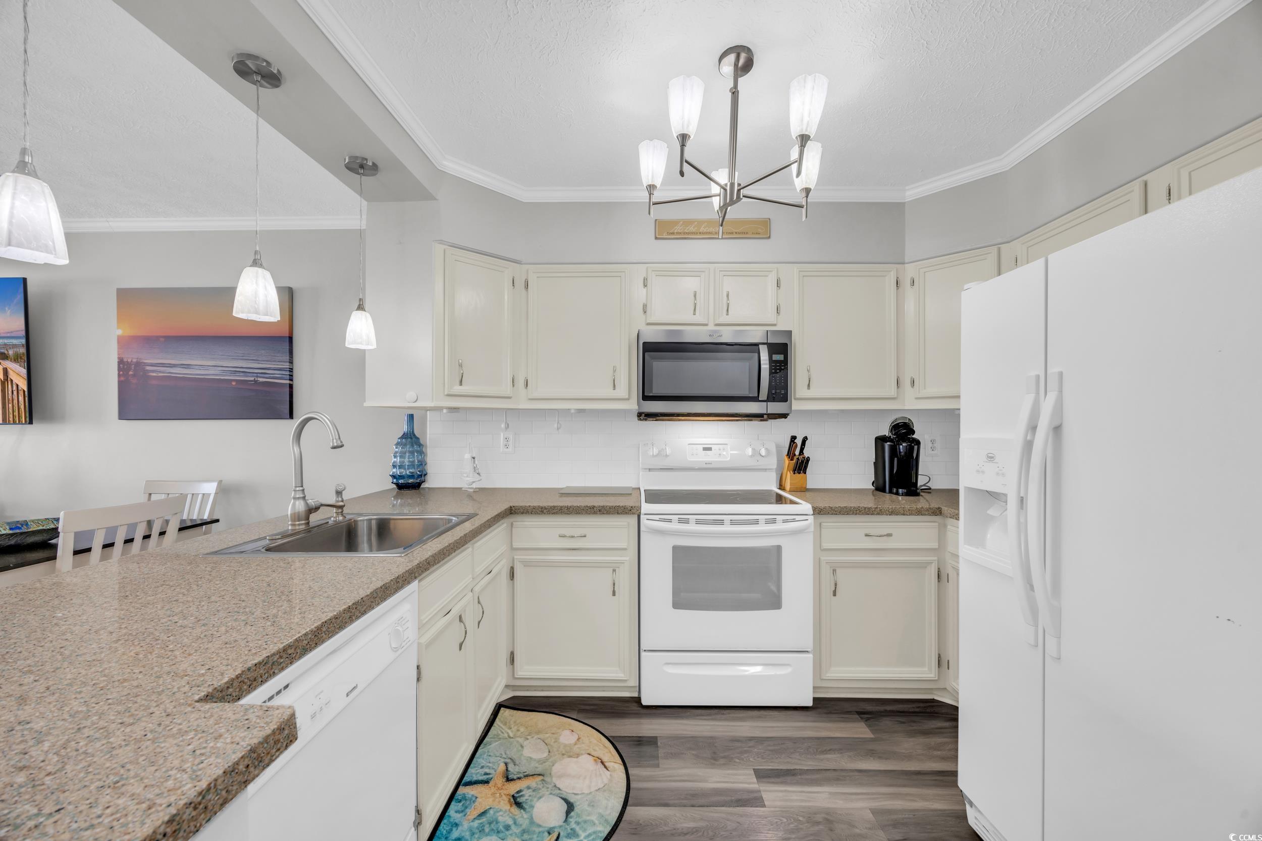 2405 South Ocean Boulevard, Unit 306 North Myrtle Beach, SC 29582 - Photo 8 of 37 Kitchen with sink, dark hardwood / wood-style floo