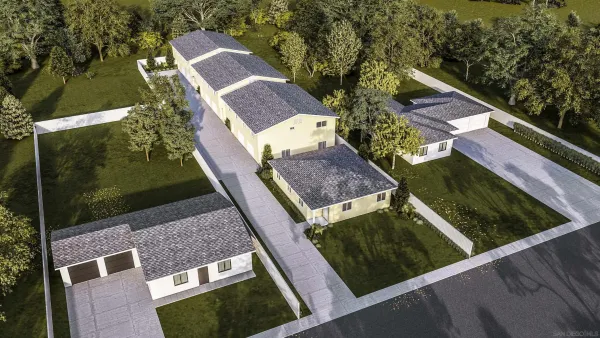 a aerial view of a house with a yard