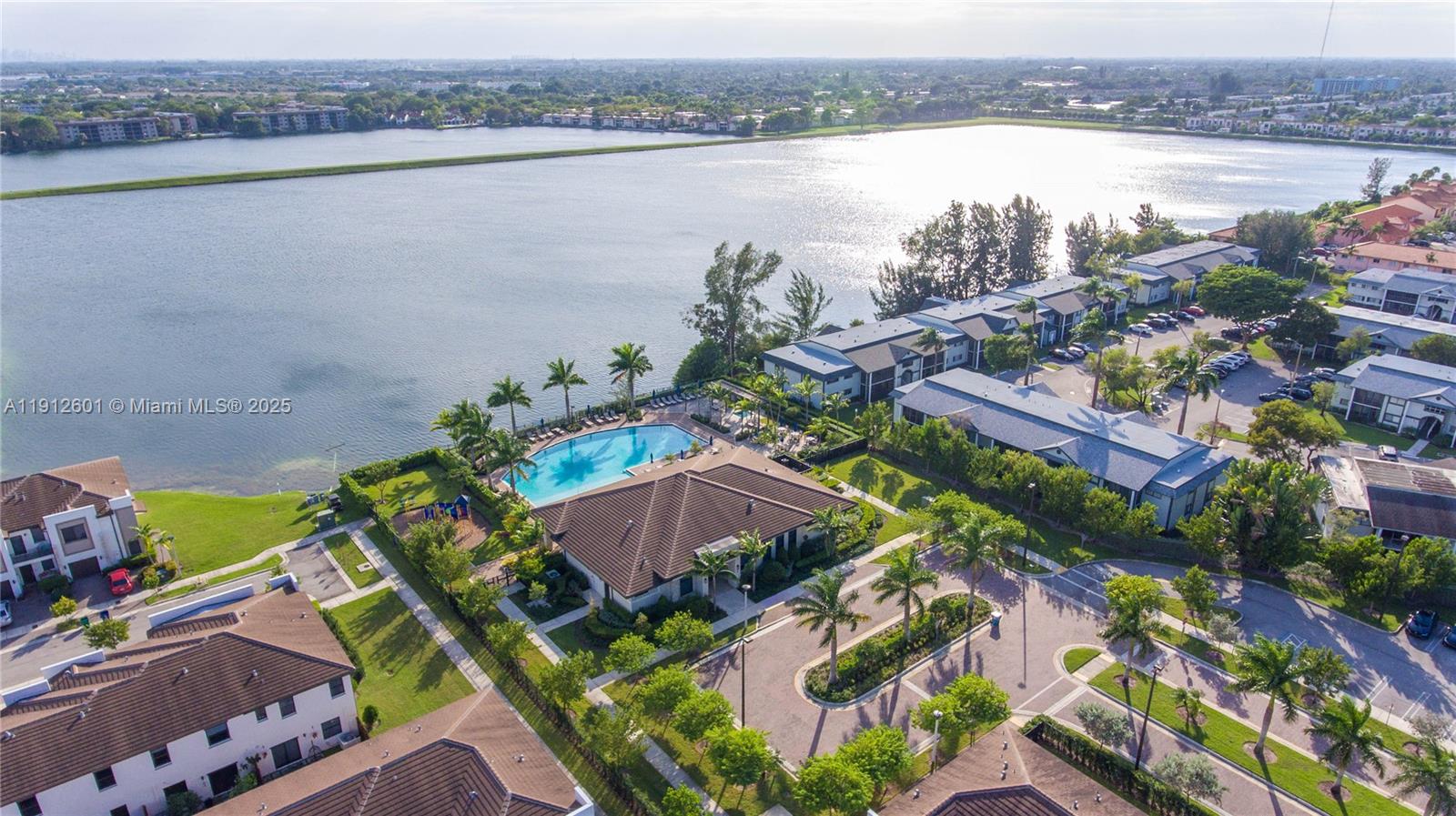 561 Northeast 208th Terrace, Unit 561 Miami, FL 33179 - Photo 12 of 31 a view of a lake with a lake