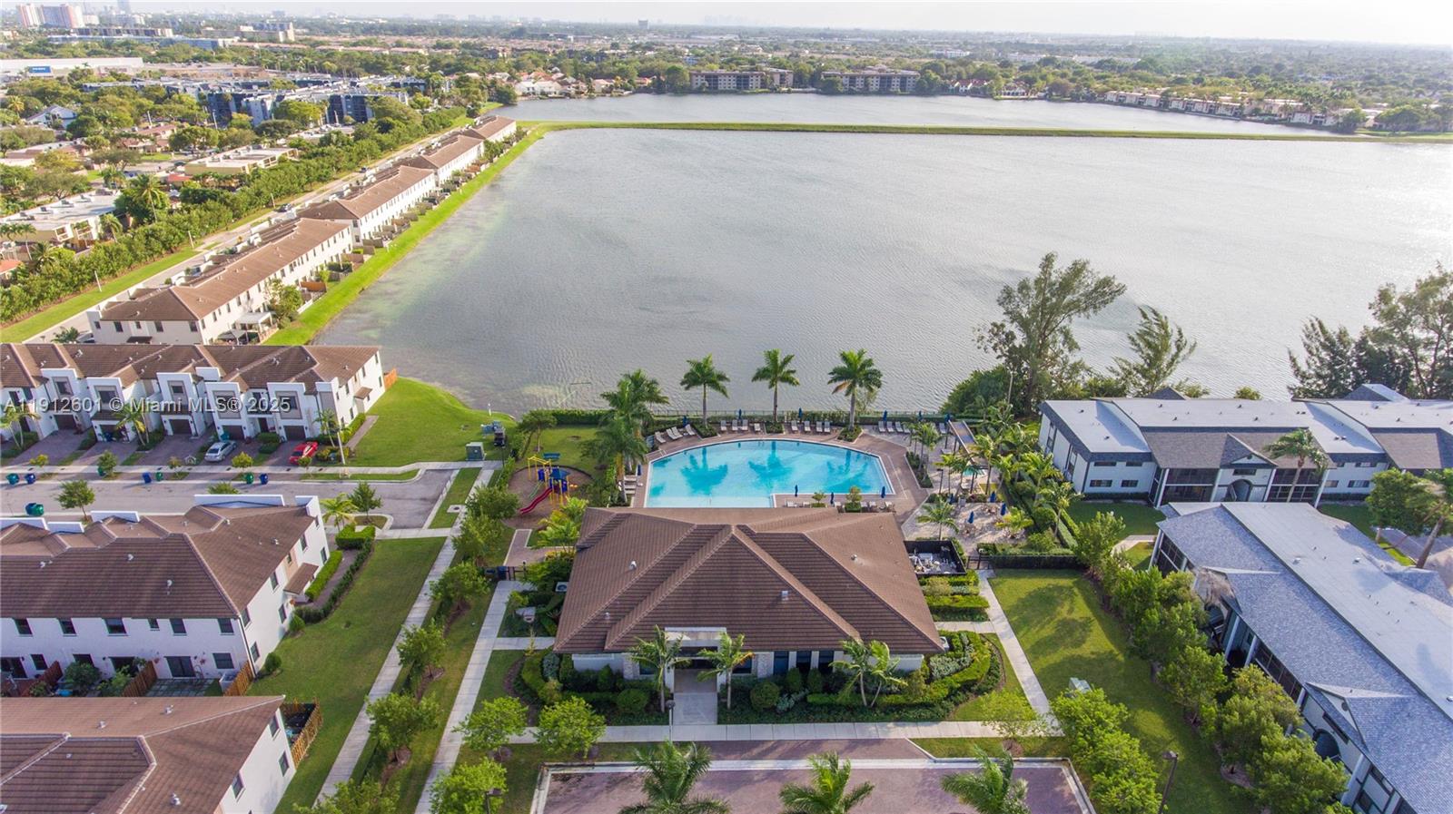 561 Northeast 208th Terrace, Unit 561 Miami, FL 33179 - Photo 13 of 31 an aerial view of a house with a lake view