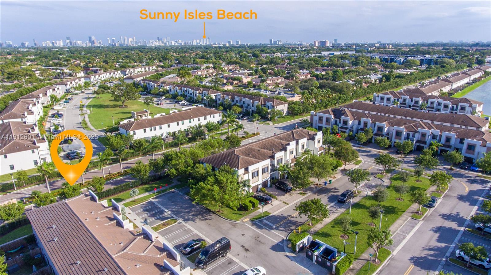 561 Northeast 208th Terrace, Unit 561 Miami, FL 33179 - Photo 9 of 31 an aerial view of residential houses with outdoor space and swimming pool