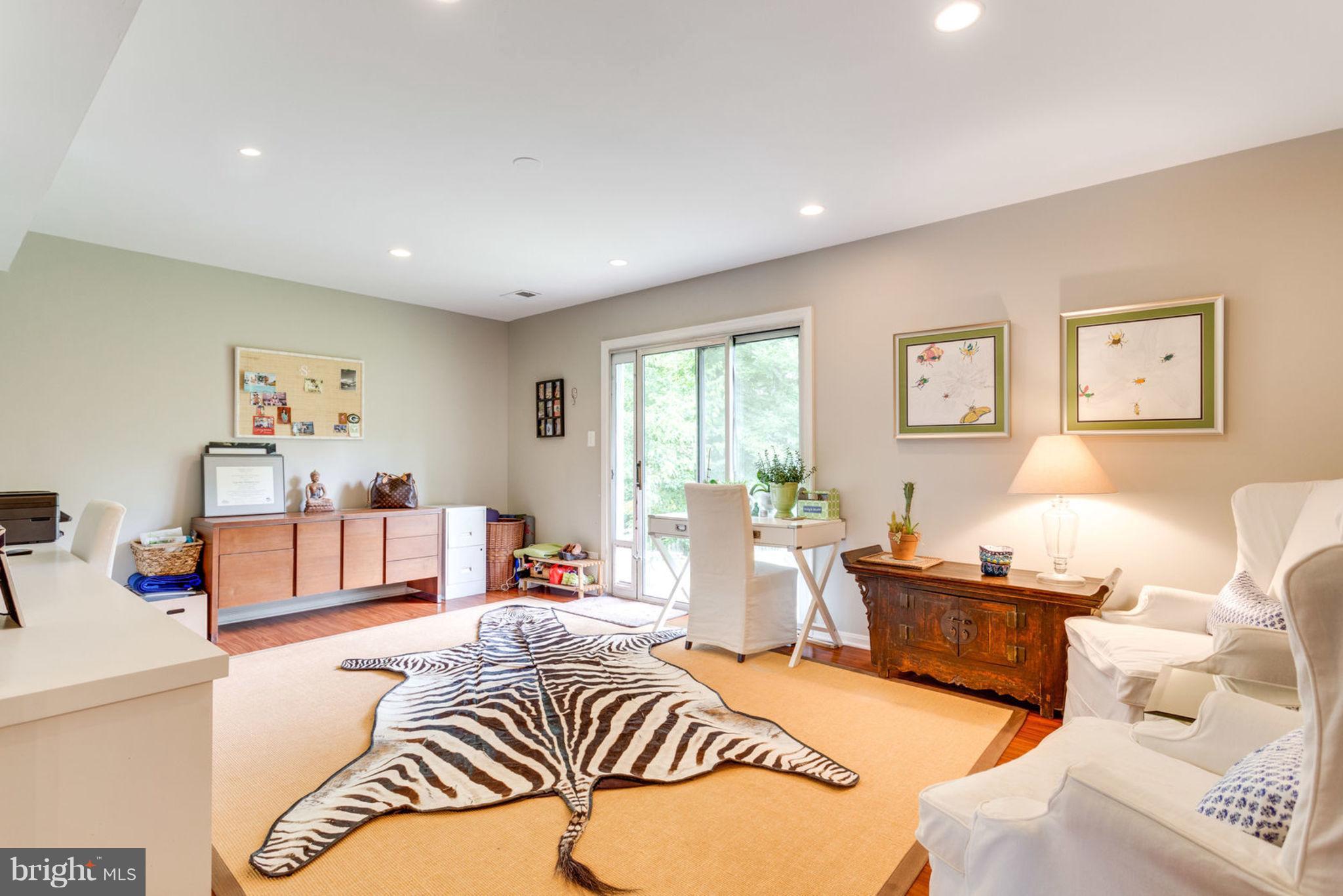 7102 Thrasher Road McLean, VA 22101 - Photo 10 of 23 Recreation room/office with doors to back yard