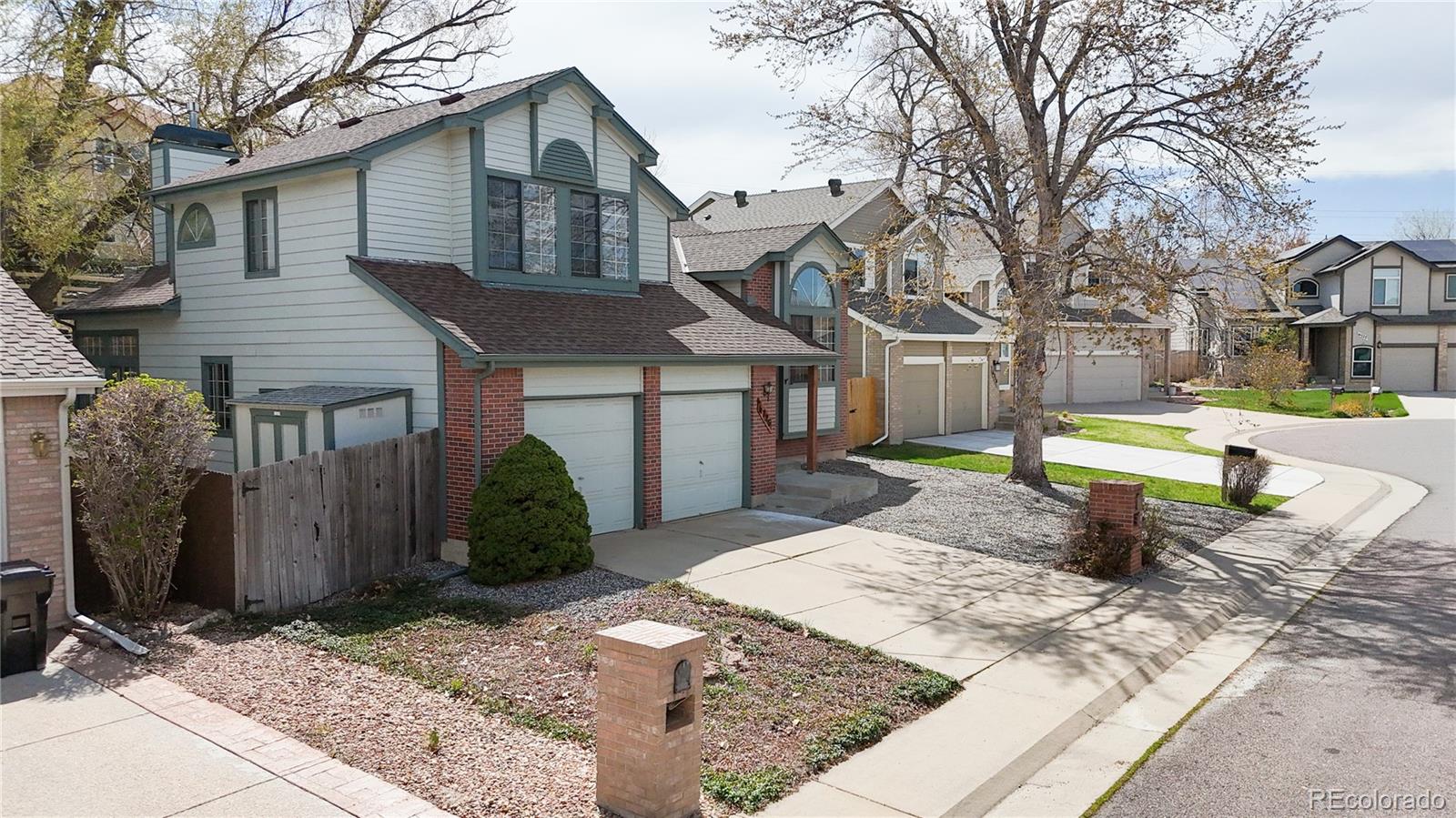 6726 Taft Circle Arvada, CO 80004 - Photo 29 of 41 a front view of a house with a yard