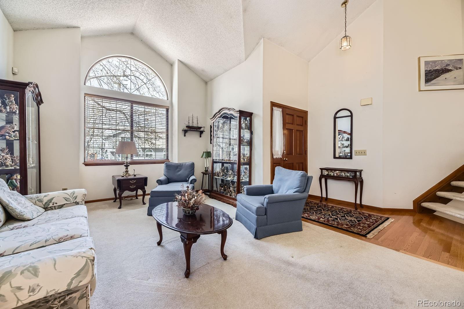 6726 Taft Circle Arvada, CO 80004 - Photo 4 of 41 a living room with furniture and a large window