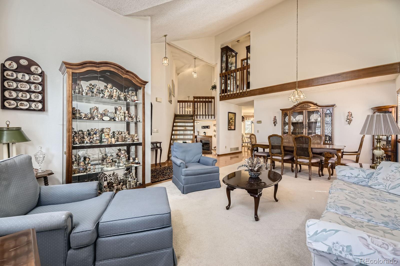 6726 Taft Circle Arvada, CO 80004 - Photo 5 of 41 a living room with furniture and wooden floor