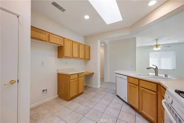 a spacious bedroom with a bed and a painting on the wall