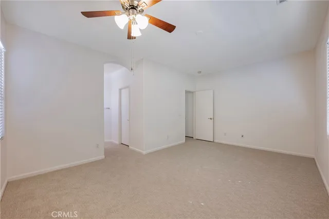 view of a house with a yard and sitting area