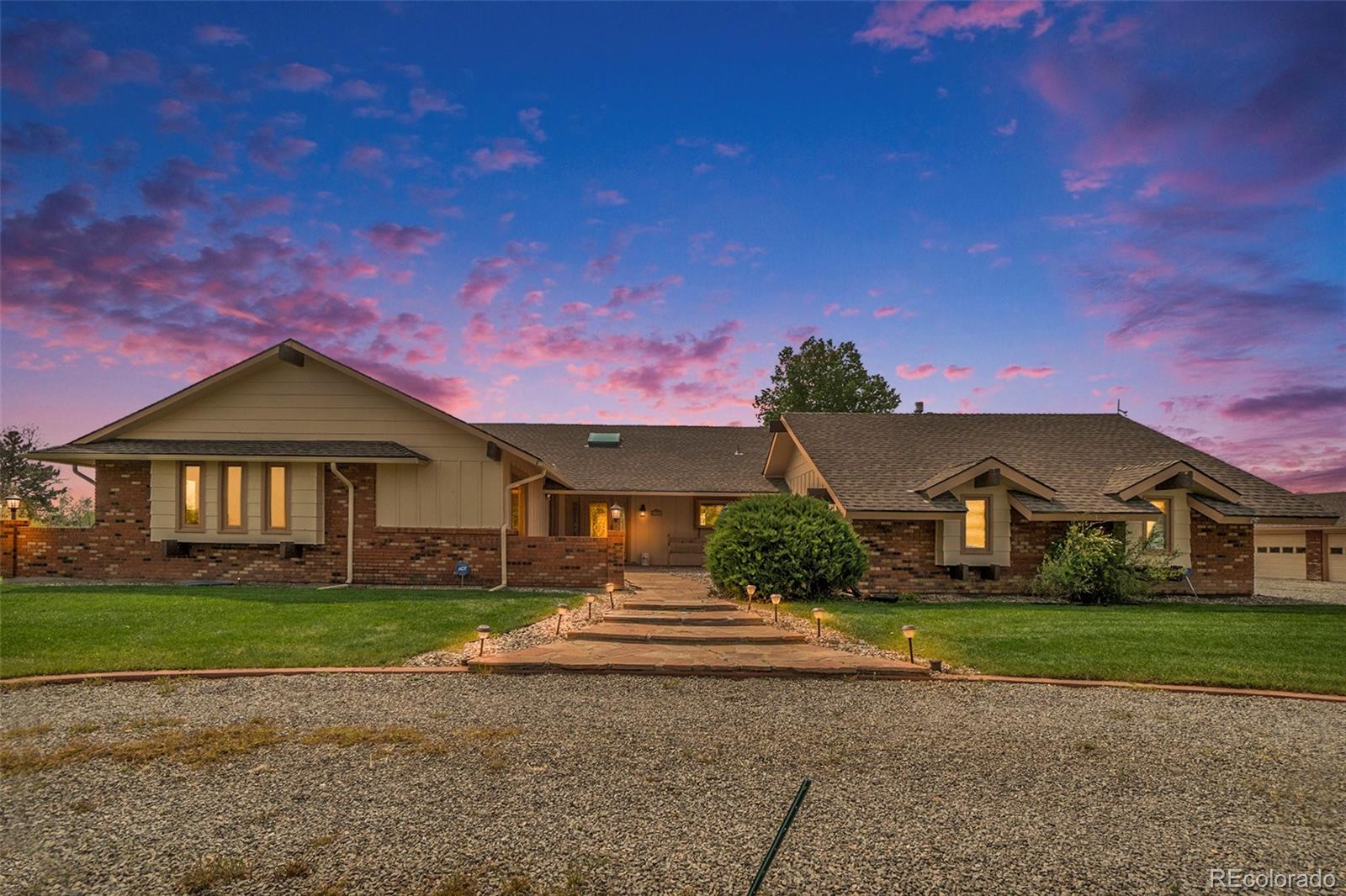 2701 Pheasant Run Berthoud, CO 80513 - Photo 1 of 40 a front view of a house with a yard