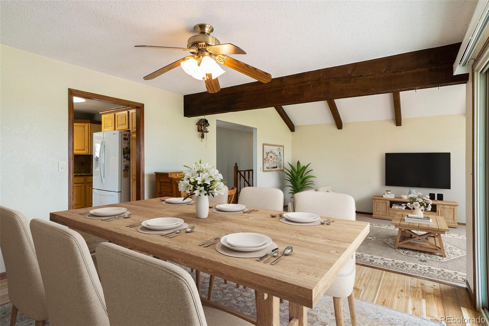 2701 Pheasant Run Berthoud, CO 80513 - Photo 13 of 40 a dining room with furniture and wooden floor