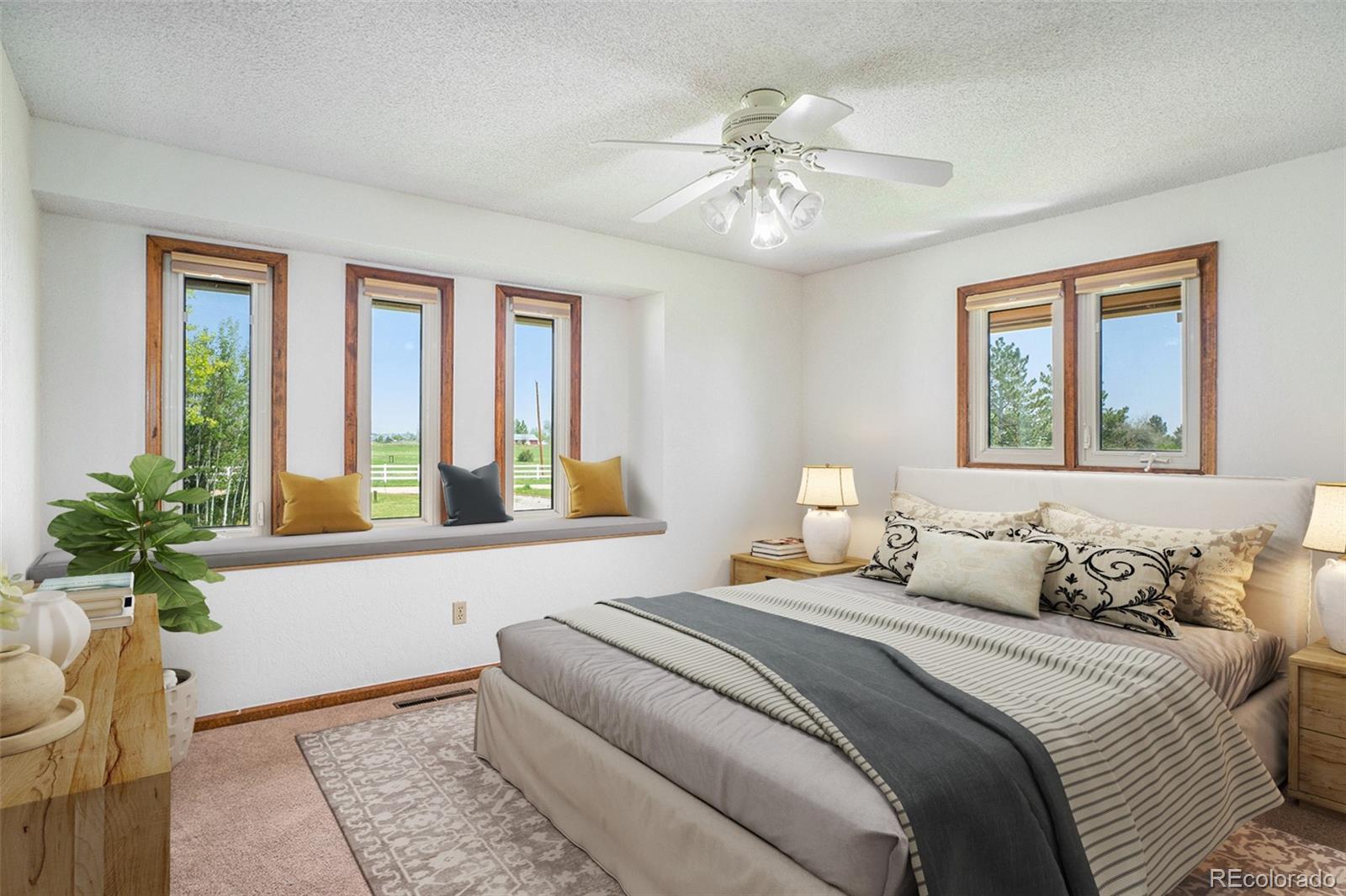 2701 Pheasant Run Berthoud, CO 80513 - Photo 25 of 40 a bedroom with a large bed and a window
