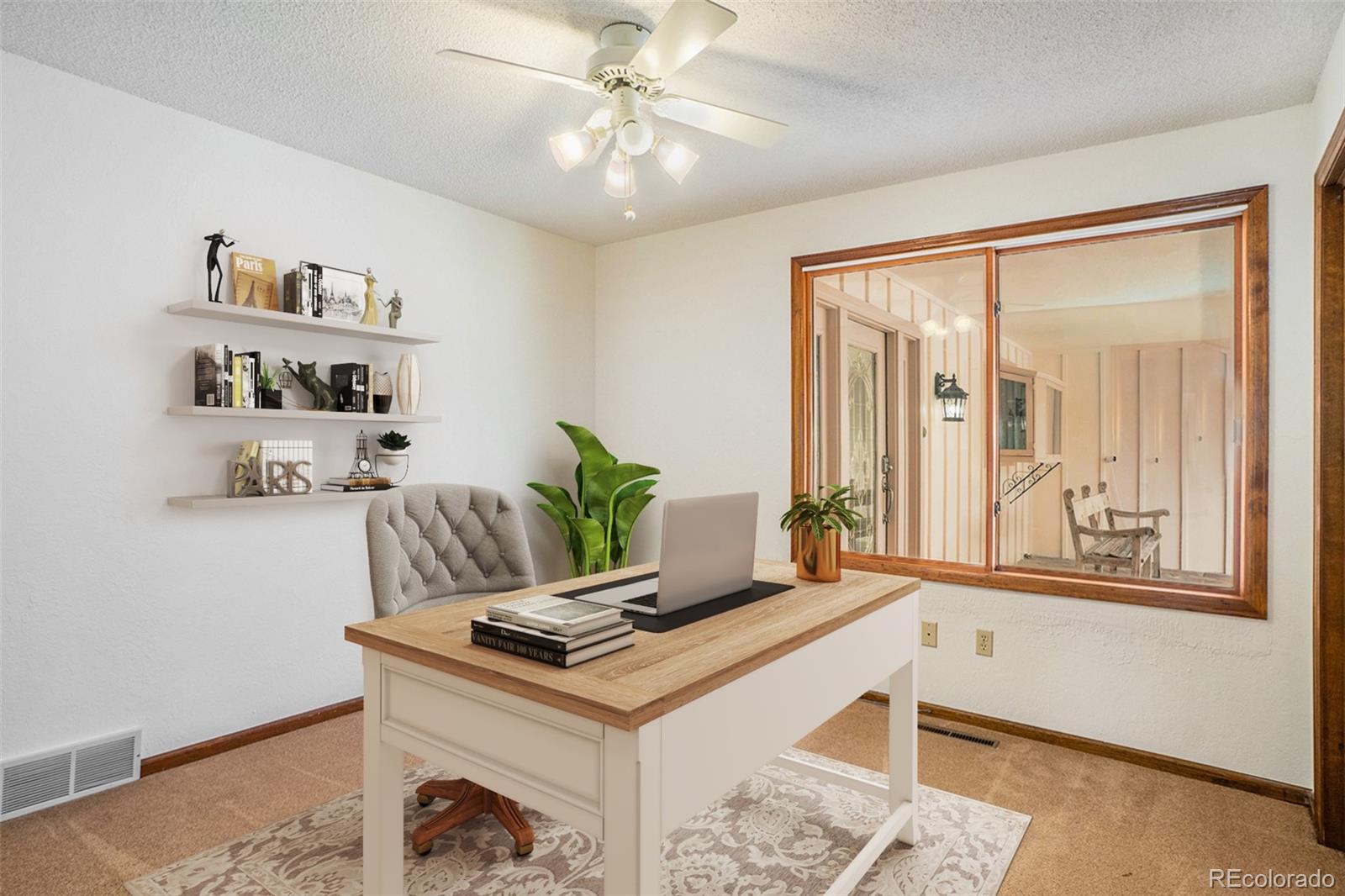 2701 Pheasant Run Berthoud, CO 80513 - Photo 27 of 40 a living room with furniture and a window