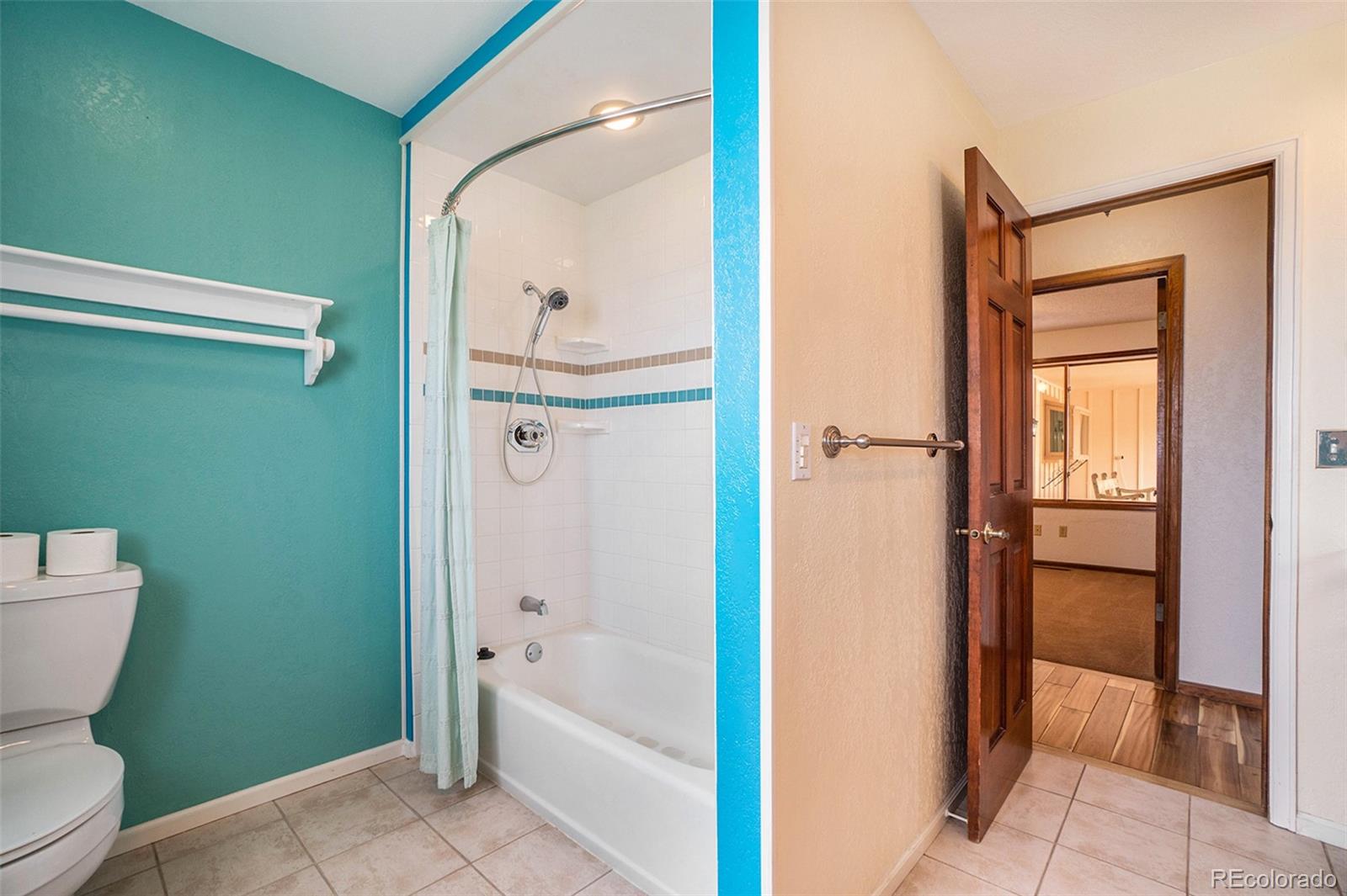 2701 Pheasant Run Berthoud, CO 80513 - Photo 31 of 40 a bathroom with a toilet a sink and bathtub