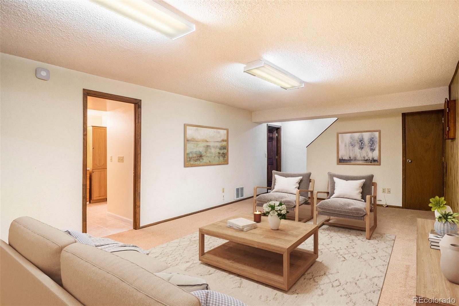 2701 Pheasant Run Berthoud, CO 80513 - Photo 33 of 40 a living room with furniture rug and wooden floor