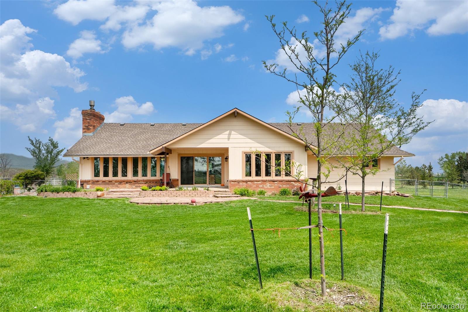 2701 Pheasant Run Berthoud, CO 80513 - Photo 37 of 40 a front view of house with yard and green space