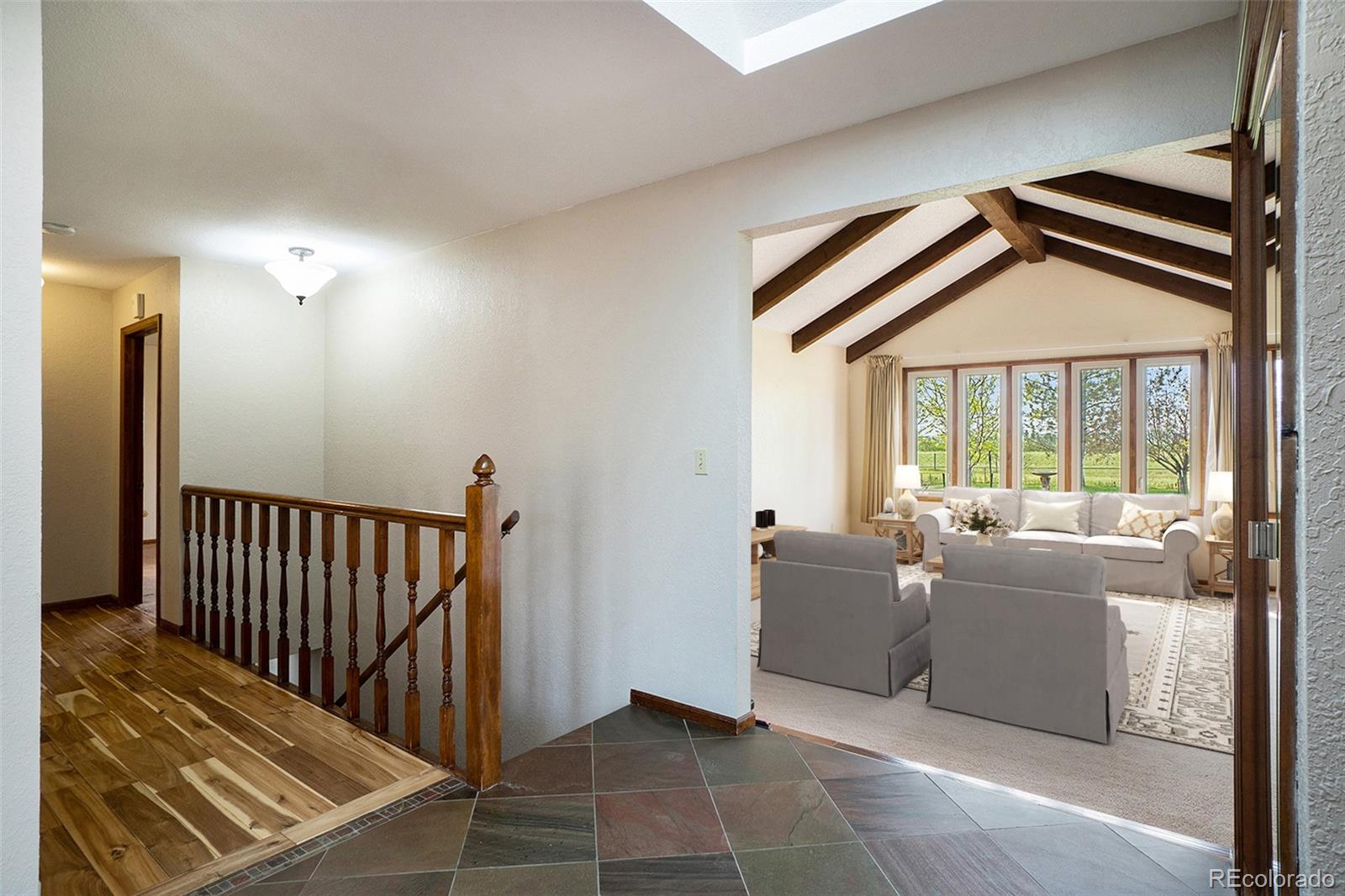 2701 Pheasant Run Berthoud, CO 80513 - Photo 9 of 40 a living room with furniture and a large window