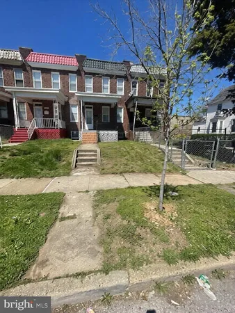 a view of a building with a yard