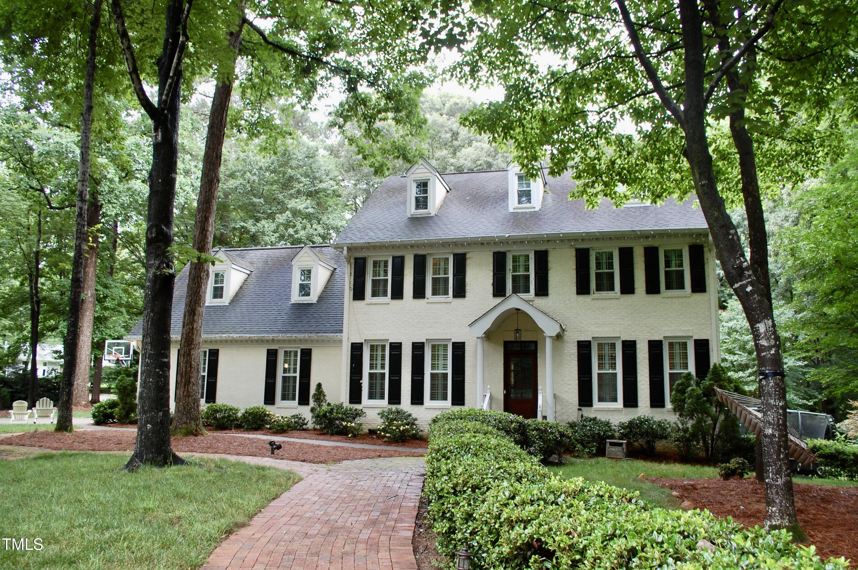 2216 Countrywood Road North Raleigh, NC 27615 - Photo 1 of 22 a front view of a house with a yard
