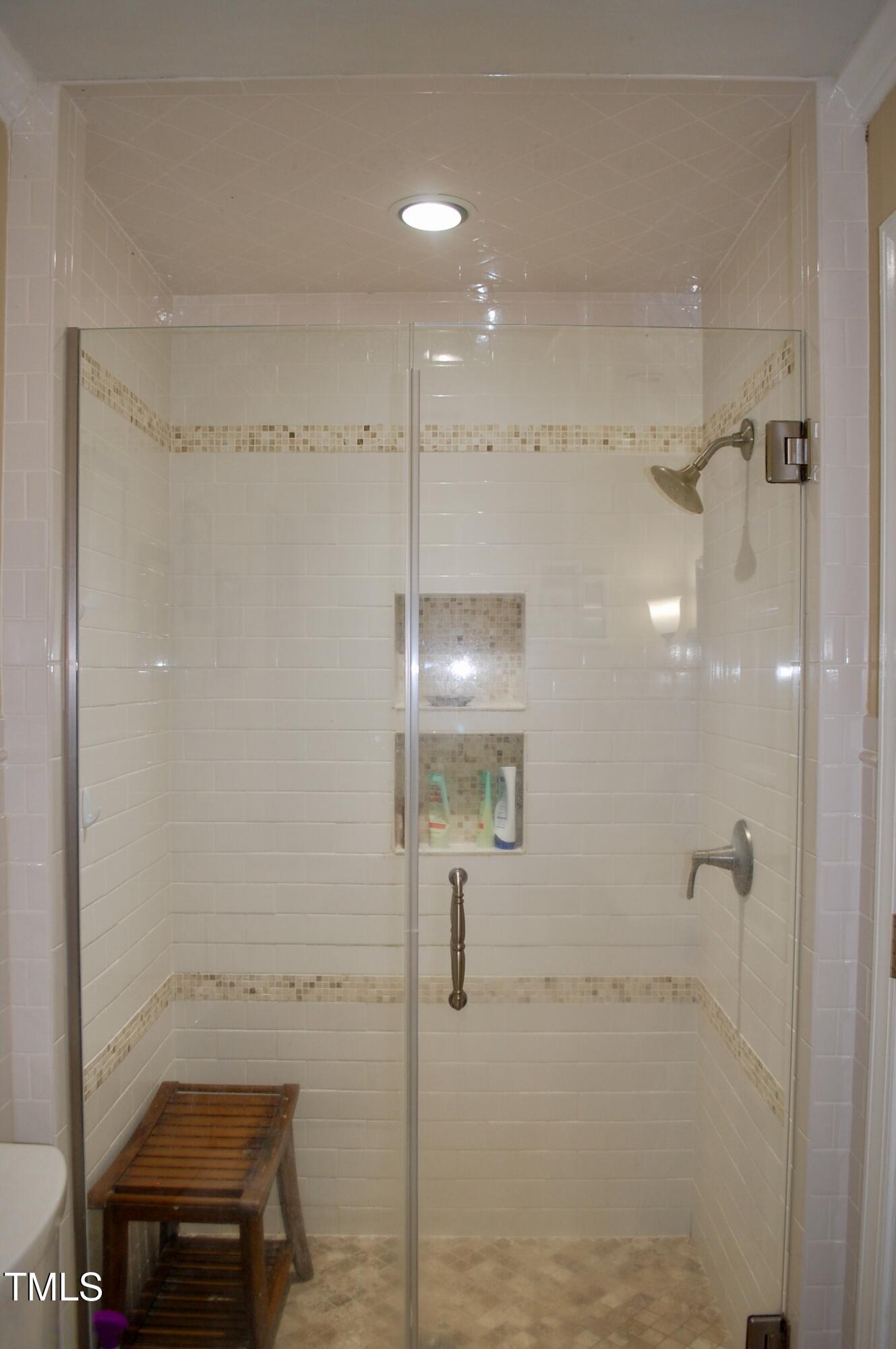 2216 Countrywood Road North Raleigh, NC 27615 - Photo 12 of 22 a bathroom with a shower