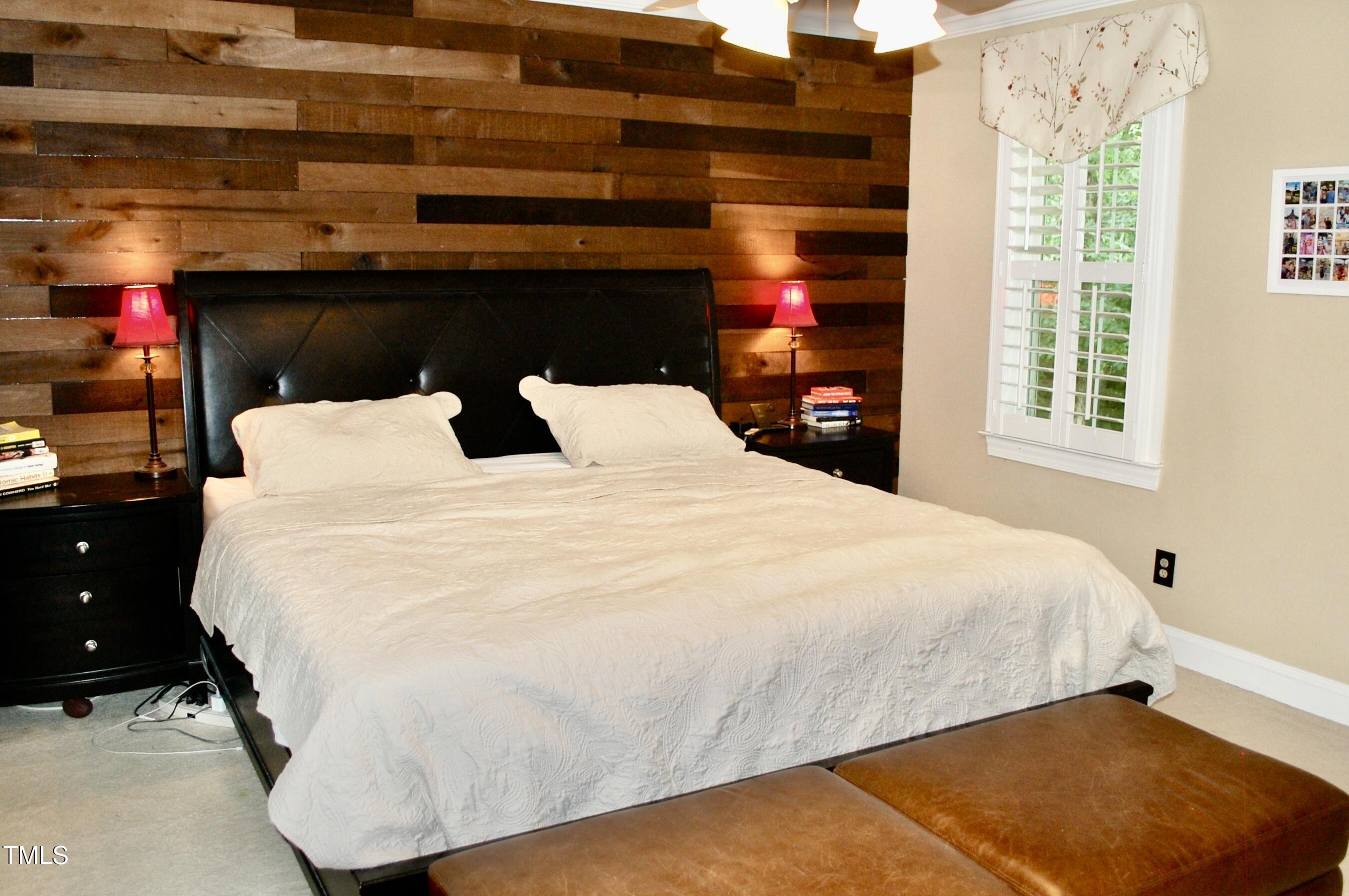 2216 Countrywood Road North Raleigh, NC 27615 - Photo 13 of 22 a bed sitting in a bedroom next to a window