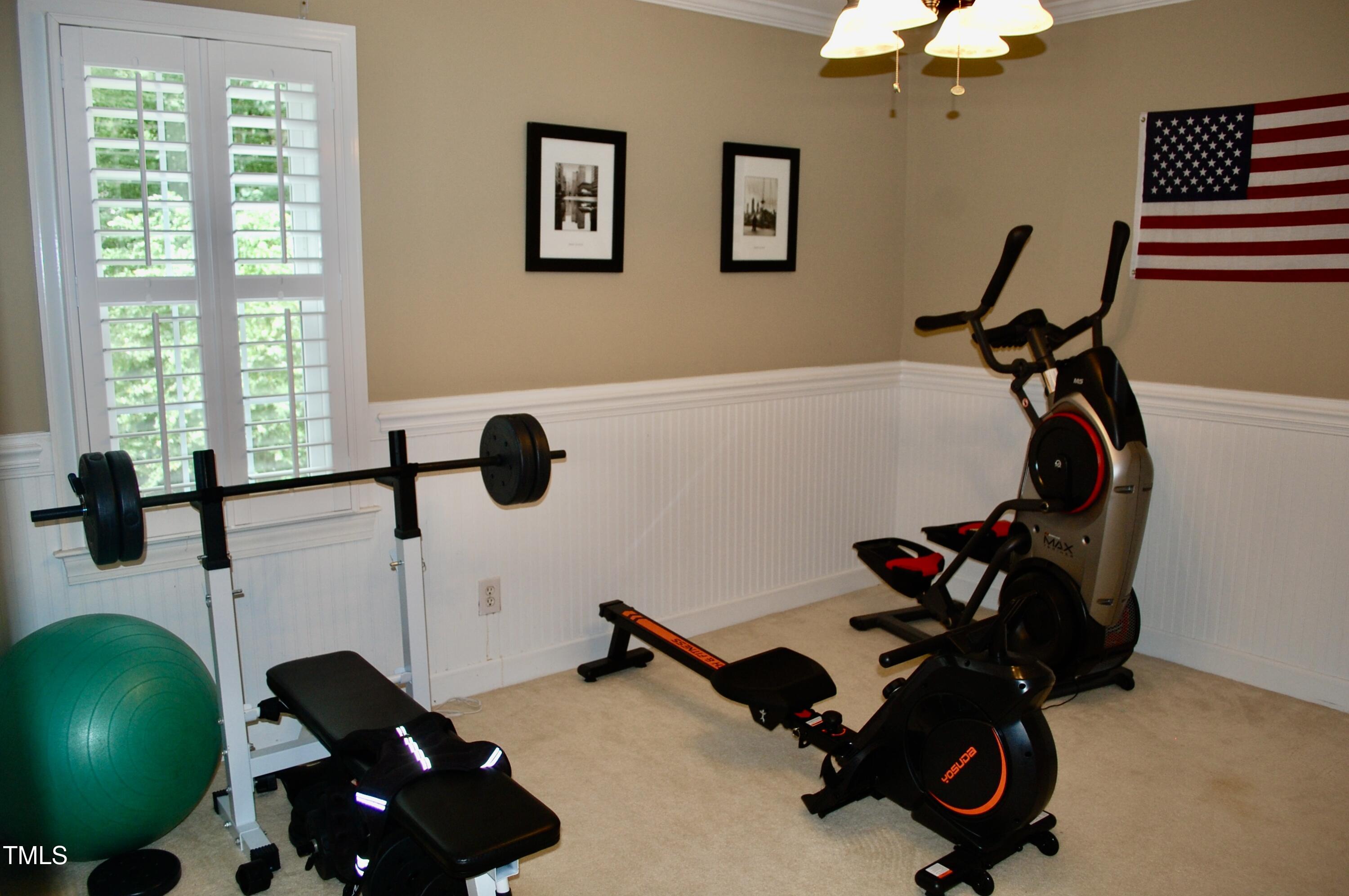 2216 Countrywood Road North Raleigh, NC 27615 - Photo 15 of 22 a room with gym equipment and a large window