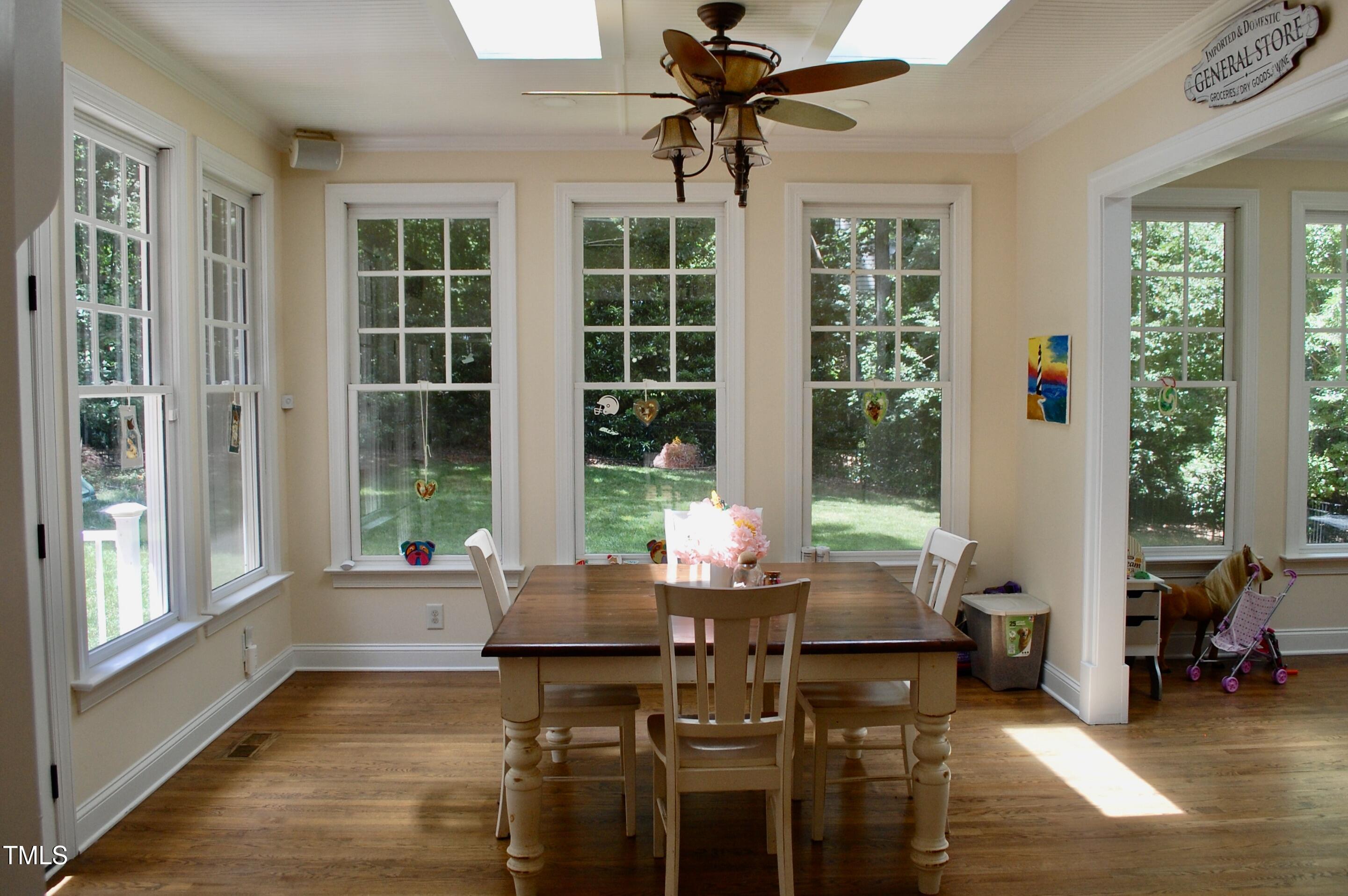2216 Countrywood Road North Raleigh, NC 27615 - Photo 7 of 22 a living room with furniture and windows