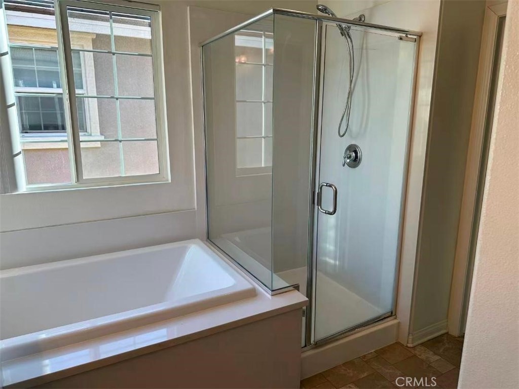 650 Huron Place Claremont, CA 91711 - Photo 13 of 28 a bathroom with a bathtub and a shower