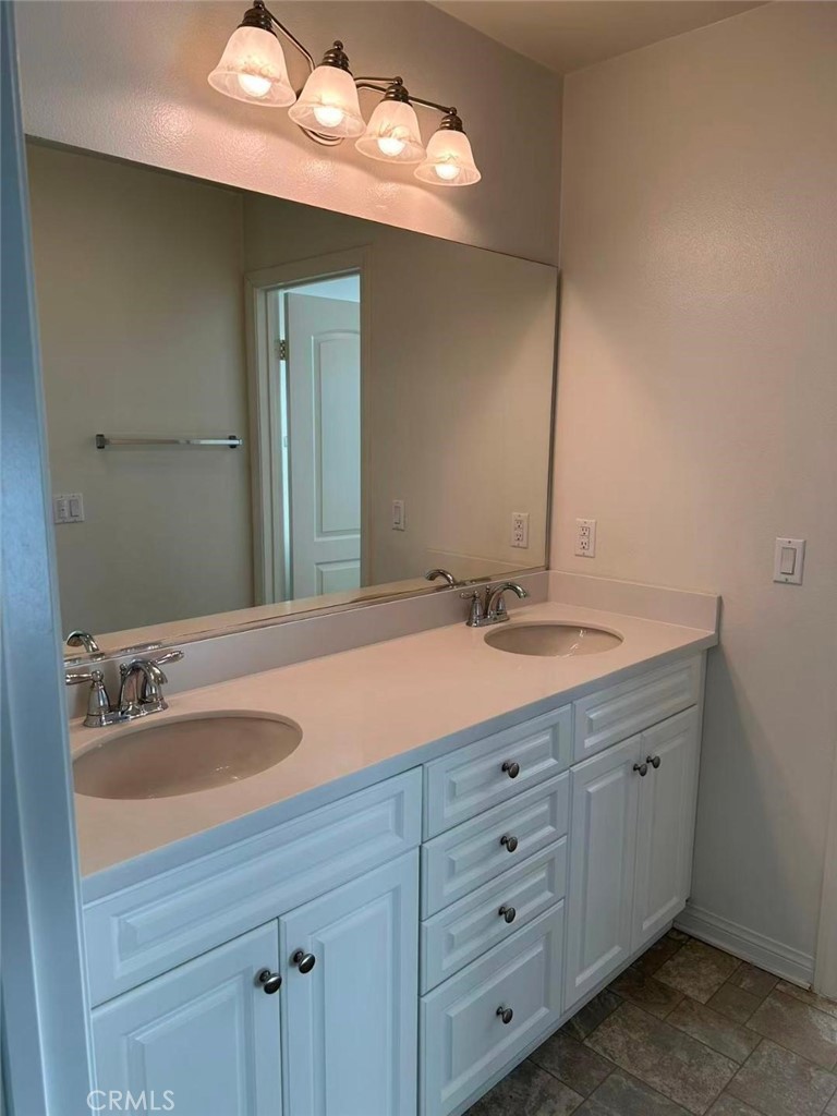 650 Huron Place Claremont, CA 91711 - Photo 19 of 28 a bathroom with a sink double vanity and a mirror