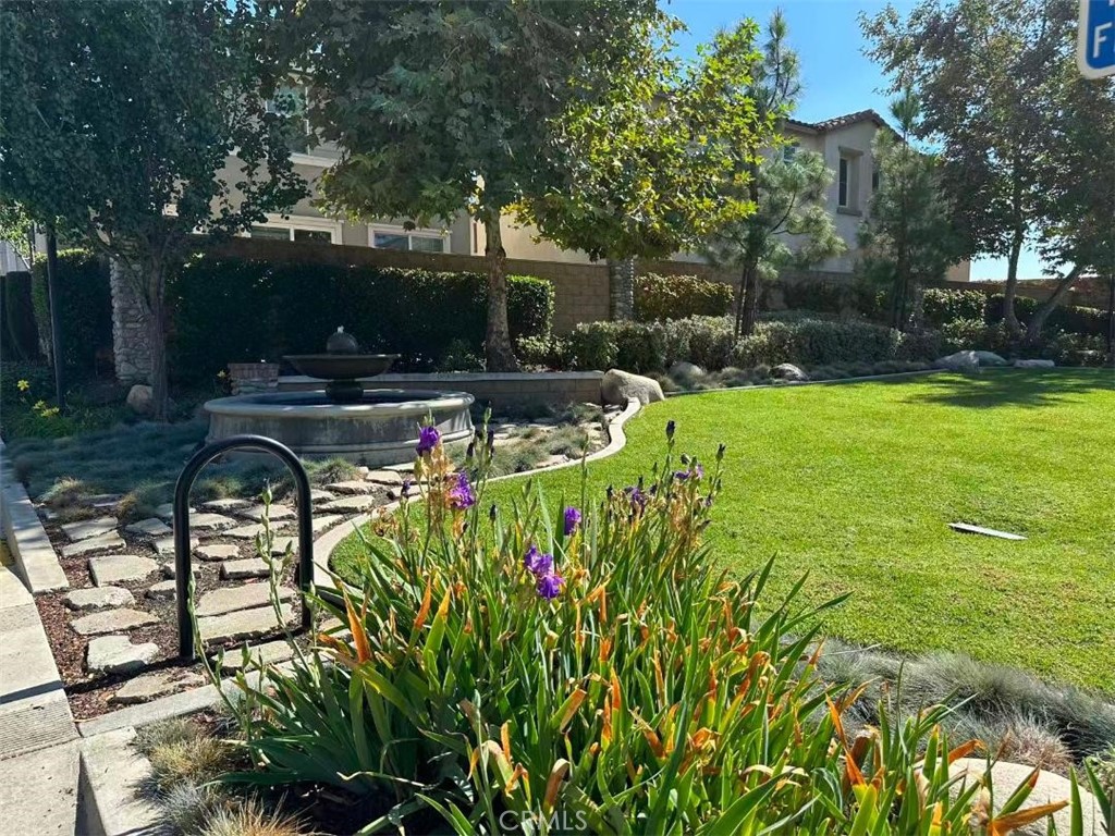 650 Huron Place Claremont, CA 91711 - Photo 26 of 28 a view of a swimming pool with a patio and a yard