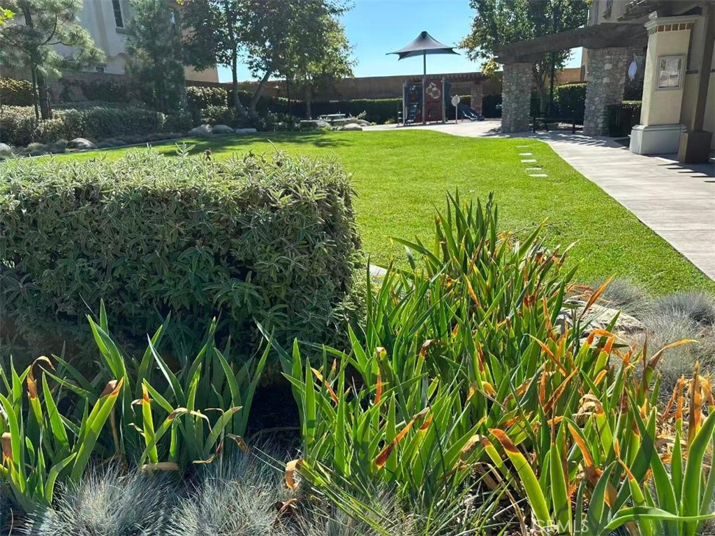 650 Huron Place Claremont, CA 91711 - Photo 28 of 28 a view of a backyard with table and chairs and potted plants