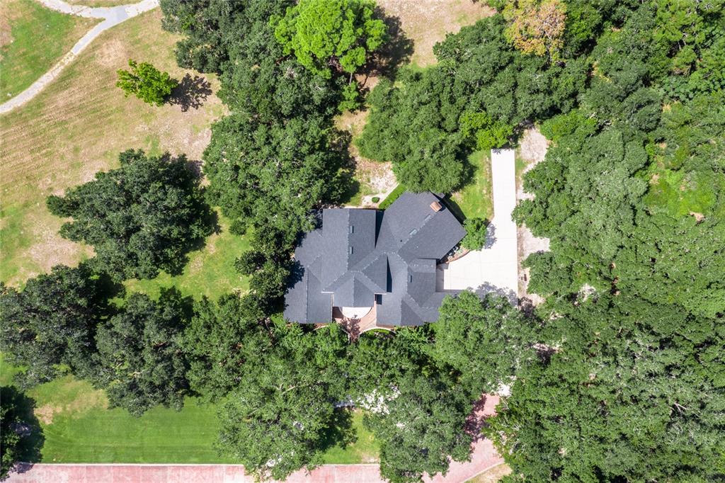 7513 Southwest 35th Way Gainesville, FL 32608 - Photo 2 of 38 an aerial view of a house with a yard and garden