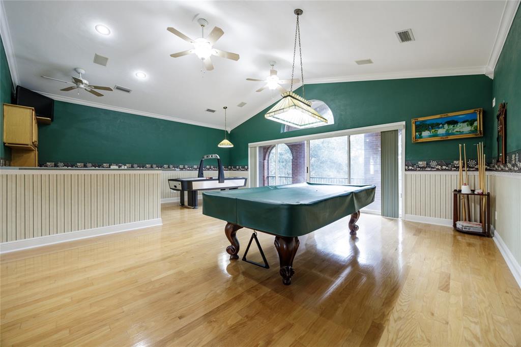 7513 Southwest 35th Way Gainesville, FL 32608 - Photo 26 of 38 a view of a room with furniture and wooden floor