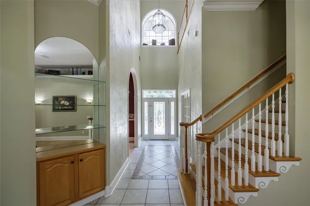 a view of a hallway view with wooden floor and staircase