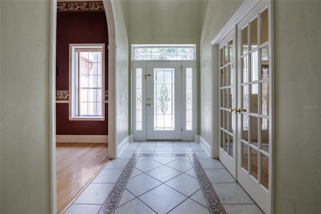 7513 Southwest 35th Way Gainesville, FL 32608 - Photo 6 of 38 a view of a hallway with windows
