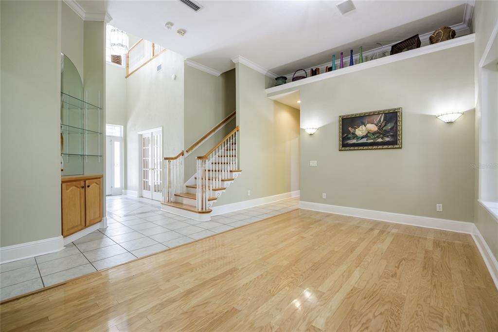 7513 Southwest 35th Way Gainesville, FL 32608 - Photo 8 of 38 a view of an entryway with wooden floor