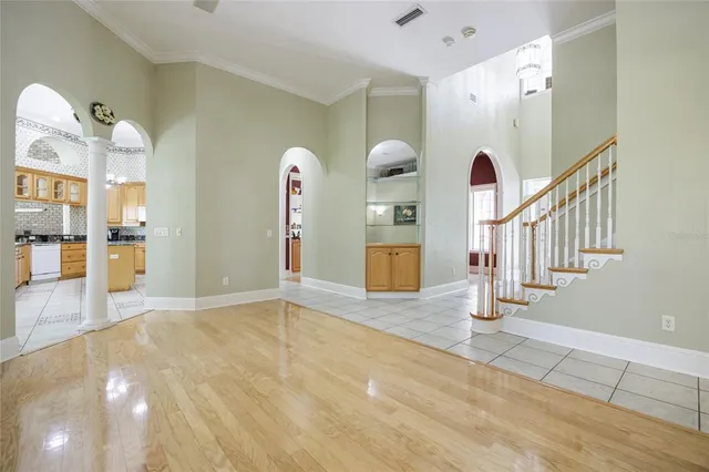 a view of an entryway with wooden floor