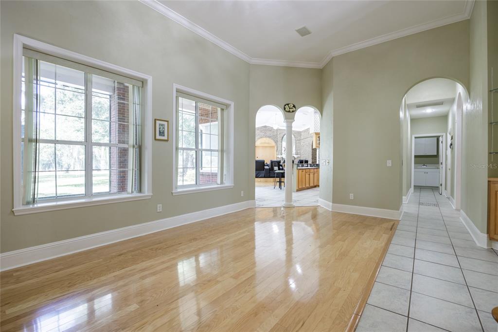 7513 Southwest 35th Way Gainesville, FL 32608 - Photo 10 of 38 a view of an empty room with glass door and windows