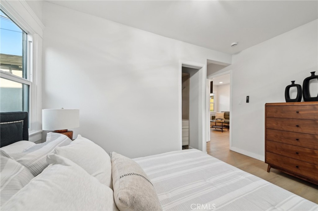 1328 Dawson Avenue Long Beach, CA 90804 - Photo 12 of 22 a bedroom with a bed and a dresser