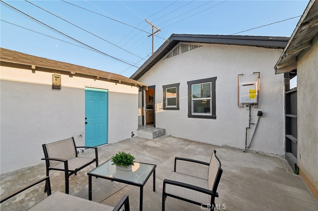 1328 Dawson Avenue Long Beach, CA 90804 - Photo 15 of 22 a backyard of a house with table and chairs